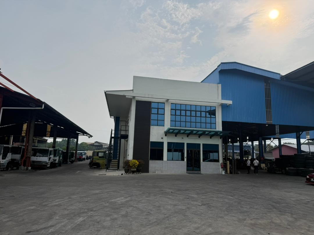 M.R. & Sons office building with covered dismantling bays.