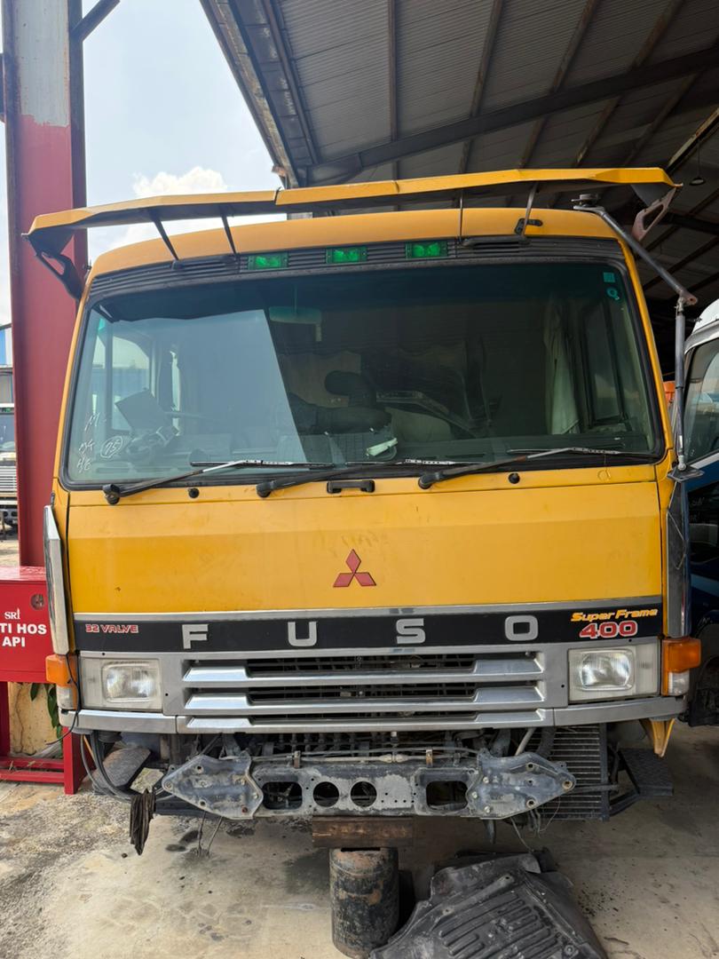 Mitsubishi Fuso cabin staged in the yard.