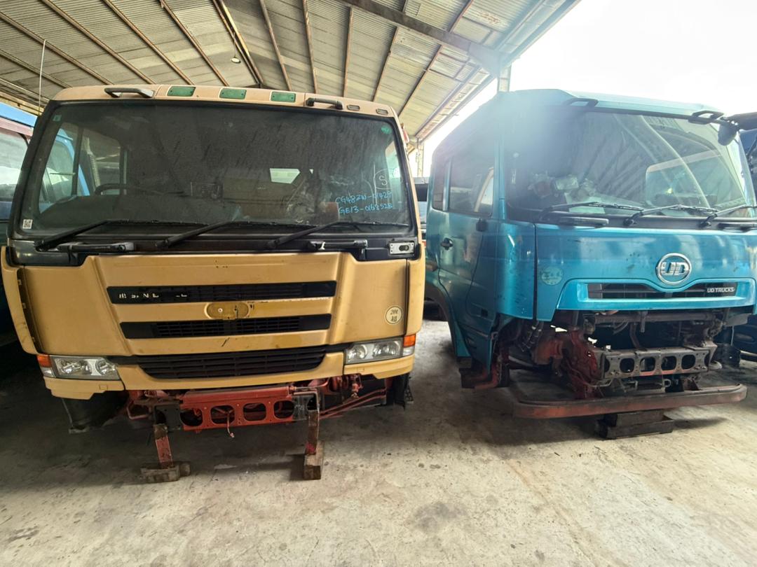 Cabin assemblies from different brands staged side by side in the yard.
