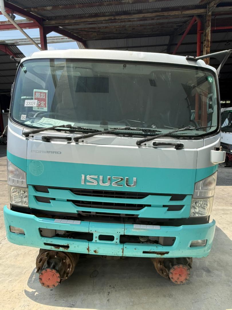 Isuzu cabin staged in the yard.