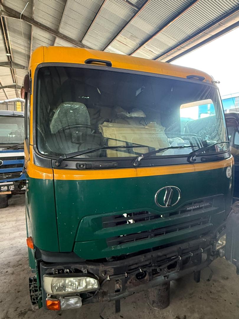 Nissan Diesel cabin assembly staged in the yard.