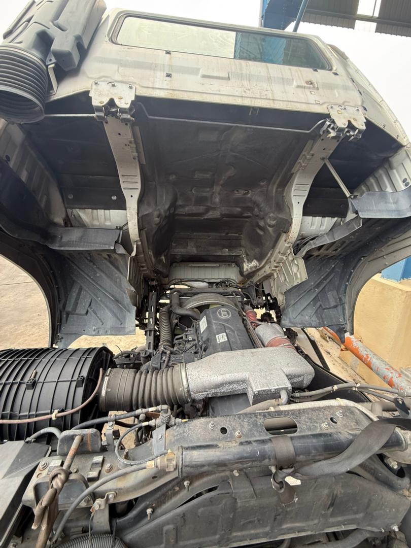 Half-cut cabin and engine bay showing a genuine Japan-imported unit ready for parts.