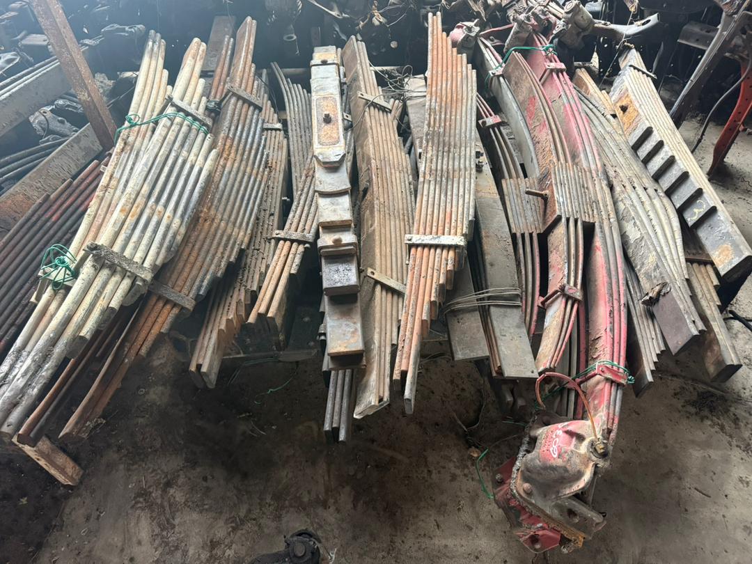 Multi-leaf suspension springs stocked in bulk.
